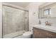 Modern bathroom featuring a glass shower and updated vanity at 12835 N 16Th Dr, Phoenix, AZ 85029