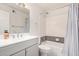 Well lit bathroom featuring stylish tiling, shower, vanity, and modern fixtures at 12835 N 16Th Dr, Phoenix, AZ 85029