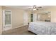 Bright bedroom featuring carpet, a fan and multiple closets at 12835 N 16Th Dr, Phoenix, AZ 85029