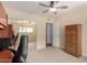 Carpeted bedroom with a large closet and wooden dresser at 12835 N 16Th Dr, Phoenix, AZ 85029