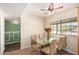 Bright dining room with large window and modern table with seating for four at 12835 N 16Th Dr, Phoenix, AZ 85029