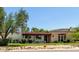 Charming single-story home with a classic red tile roof and a beautifully landscaped front yard at 12835 N 16Th Dr, Phoenix, AZ 85029