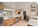 Spacious kitchen with stainless steel appliances, wood cabinets, and white countertops at 12835 N 16Th Dr, Phoenix, AZ 85029
