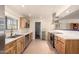 Bright kitchen with stainless steel appliances and a view to a door leading into a laundry room at 12835 N 16Th Dr, Phoenix, AZ 85029