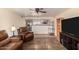 Spacious living room showcasing the kitchen with comfortable leather seating at 12835 N 16Th Dr, Phoenix, AZ 85029
