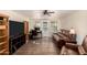 Inviting living room with wood flooring, built-in shelving, and natural light at 12835 N 16Th Dr, Phoenix, AZ 85029