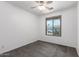 Bedroom with carpet, a ceiling fan and a window, which offers plenty of natural light at 12950 W Alegre Dr, Litchfield Park, AZ 85340