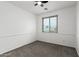 Inviting bedroom with large window and carpeted floors at 12950 W Alegre Dr, Litchfield Park, AZ 85340