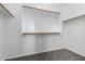 Walk-in closet with ample storage space and shelving units at 12950 W Alegre Dr, Litchfield Park, AZ 85340
