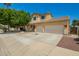 Attractive two-story home featuring a two-car garage and low-maintenance desert landscaping at 12950 W Alegre Dr, Litchfield Park, AZ 85340
