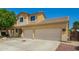 Well-maintained two-story house featuring a two-car garage and easy desert landscaping at 12950 W Alegre Dr, Litchfield Park, AZ 85340