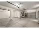 Spacious garage with high ceilings, work area and ample storage space at 12950 W Alegre Dr, Litchfield Park, AZ 85340