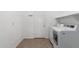 Laundry room features a washing machine and dryer along with tile flooring at 12950 W Alegre Dr, Litchfield Park, AZ 85340