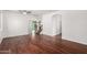 Open-concept living room with beautiful hardwood floors and staircase at 12950 W Alegre Dr, Litchfield Park, AZ 85340