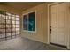 Cozy front porch featuring ample space, natural light, and a secure front entrance at 12950 W Alegre Dr, Litchfield Park, AZ 85340