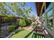 Beautiful backyard featuring artificial grass, rock landscaping, a hot tub, and a privacy fence at 13252 W Steed Ridge Rd, Peoria, AZ 85383