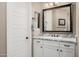 Well-lit bathroom with a large mirror and plenty of storage at 13252 W Steed Ridge Rd, Peoria, AZ 85383