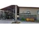Beautiful clubhouse featuring modern architecture, desert landscaping, and inviting entrance, a central hub for community activities at 13252 W Steed Ridge Rd, Peoria, AZ 85383