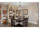 Dining room featuring a modern chandelier, stylish décor, and herringbone floors, perfect for Gathering gatherings at 13252 W Steed Ridge Rd, Peoria, AZ 85383
