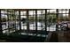 Inviting indoor pool area featuring expansive windows, allowing ample natural light and offering a serene swimming experience at 13252 W Steed Ridge Rd, Peoria, AZ 85383