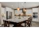 Gourmet kitchen boasting white cabinetry, a spacious island, and modern stainless-steel appliances, great for cooking at 13252 W Steed Ridge Rd, Peoria, AZ 85383