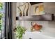 Living room showing bespoke design elements and shelving for displaying plants and decor, with marble-look accents at 13252 W Steed Ridge Rd, Peoria, AZ 85383