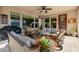 Relaxing covered patio with comfortable seating, grill, and views of backyard at 13252 W Steed Ridge Rd, Peoria, AZ 85383