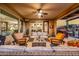 Outdoor patio area with comfortable seating, a ceiling fan, desert landscape and a ceiling fan at 13252 W Steed Ridge Rd, Peoria, AZ 85383