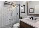 Bathroom featuring a tiled shower with a glass enclosure, modern fixtures, and a stylish vanity at 13634 W San Miguel Ave, Litchfield Park, AZ 85340