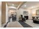 Sophisticated living room boasts hardwood floors, two accent chairs, and a comfortable couch with decorative pillows at 13634 W San Miguel Ave, Litchfield Park, AZ 85340
