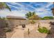 Large backyard with desert landscaping, brick pavers, and mountain views at 1410 W Popcorn Tree Ave, Queen Creek, AZ 85140