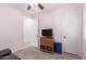 Comfortable bedroom featuring stylish flooring and a ceiling fan at 1410 W Popcorn Tree Ave, Queen Creek, AZ 85140