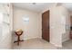 Welcoming entryway with tile flooring, a decorative globe, and a charming window bringing in natural light at 1410 W Popcorn Tree Ave, Queen Creek, AZ 85140