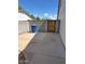 The fenced backyard has a concrete pad, a block wall, and a gate at 1616 W Temple St, Chandler, AZ 85224