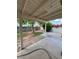 Covered patio overlooks the landscaped backyard featuring a pathway and perimeter of colorful plants at 1616 W Temple St, Chandler, AZ 85224