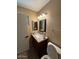 Cozy bathroom features a granite countertop and modern lighting at 1616 W Temple St, Chandler, AZ 85224