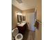 Bathroom featuring granite countertop, modern lighting, and wood-look flooring at 1616 W Temple St, Chandler, AZ 85224