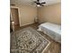 Bright bedroom featuring laminate wood floors, area rug, and ceiling fan at 1616 W Temple St, Chandler, AZ 85224