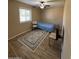 Cozy bedroom features wood-look floors and a ceiling fan at 1616 W Temple St, Chandler, AZ 85224