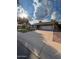 A single-story home with a two-car garage and a well-maintained front lawn at 1616 W Temple St, Chandler, AZ 85224