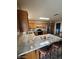 Spacious kitchen with granite countertops, wood cabinets, stainless appliances, and breakfast bar seating at 1616 W Temple St, Chandler, AZ 85224