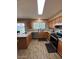 Modern kitchen features granite countertops, stainless steel appliances, and updated lighting at 1616 W Temple St, Chandler, AZ 85224