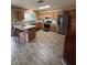 Spacious kitchen featuring wood cabinets, stainless steel appliances, and a center island at 1616 W Temple St, Chandler, AZ 85224