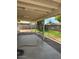 The covered patio has a large concrete pad and views of the grassy yard at 1616 W Temple St, Chandler, AZ 85224
