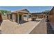 Spacious backyard featuring a paved patio, wooden pergola, and well-maintained landscaping at 17421 N 14Th St, Phoenix, AZ 85022