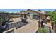 Wide angle of a patio with pavers, a wooden pergola and lights hanging from it at 17421 N 14Th St, Phoenix, AZ 85022