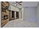 Bedroom featuring a ceiling fan, wood accent wall, and sliding closet doors for storage solutions at 17421 N 14Th St, Phoenix, AZ 85022