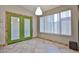 Dining area with tile floors, a window for natural light, and access to backyard at 17421 N 14Th St, Phoenix, AZ 85022