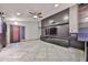 Spacious living room with tile flooring, built in storage, and a neutral color scheme at 17421 N 14Th St, Phoenix, AZ 85022
