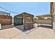 Charming outdoor patio featuring a wooden pergola, built-in seating, and patterned pavers at 17421 N 14Th St, Phoenix, AZ 85022